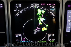 Real life capture of a weather radar showing cumulonimbus clouds embedded with thunderstorms (in red)