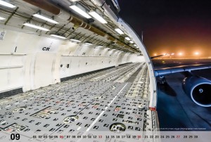 September motive of the MD-11 Calendar 2015 showing the cargo hold of a Lufthansa Cargo MD-11 at night.